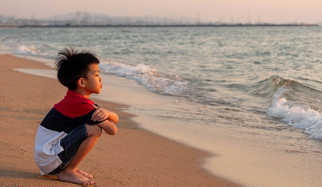 Boy looking out to ocean